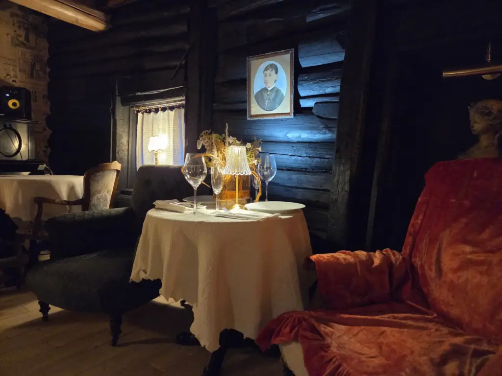 A photograph from the project: the hall’s furniture, lighting and interior details.